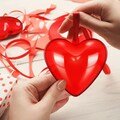 Whimsical Heart Shaped Plastic Party Favors. Food Safe Plastic Carrots. Assembly required. 2.5" inches tall x 2.5" inches wide.